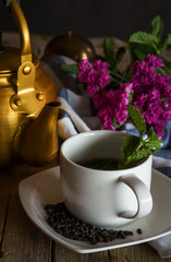 Vintage kettle with glass of tea