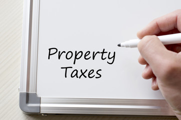 Property taxes written on whiteboard