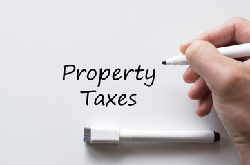Property taxes written on whiteboard