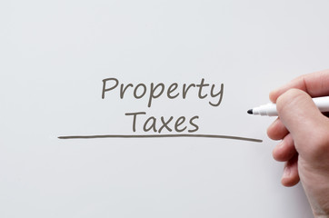 Property taxes written on whiteboard