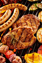 Assorted grilled meat and vegetables on barbecue - obrazy, fototapety, plakaty