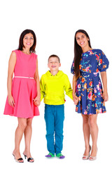 Obraz premium Two sports body figure tanned beautiful women, girlfriends, sisters in summer dress with brother, boy teen, son looking in camera. Isolated on white. Positive human emotion. Concept of friendly family