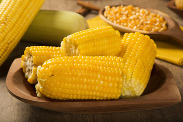 close view on Homemade golden corn cob with butter and salt on t