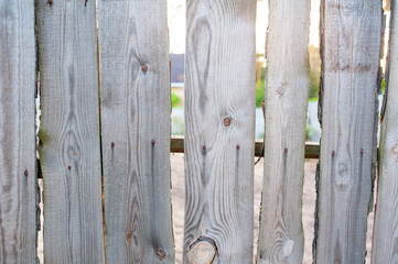 old wooden fence in the village near house