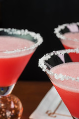 Strawberry margarita cocktail garnished with salt rim.