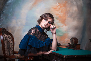 Portrait of a cute teenage girl in a vintage dress.