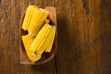 close view on Homemade golden corn cob with butter and salt on t