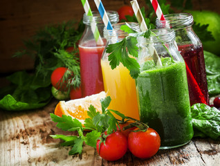 Set of fruit and vegetable juices, old wooden background, select