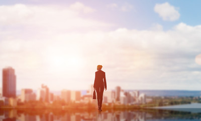 Businesswoman facing new day