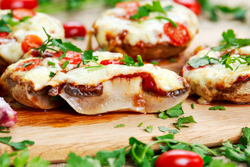 Cooked Mushrooms stuffed with cheese and plum tomatoes