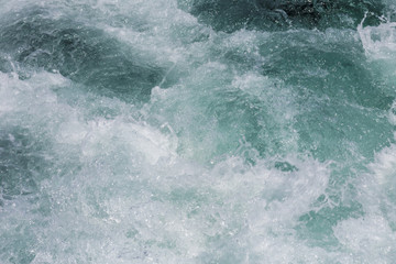 Fototapeta na wymiar Water wave and heavy splash for background
