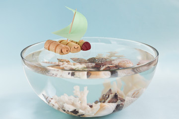 boat and shells in a bowl