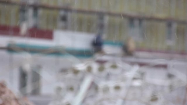 Workers installs plastic siding