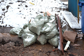 bags of garbage on the street. environmental pollution.