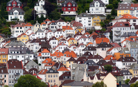 View of new coloured houses on the background of mountains, Bergen