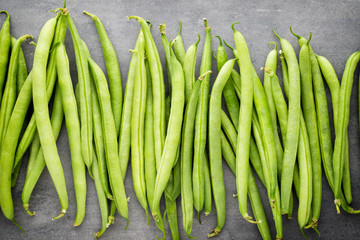 Green beans  on a gray background.