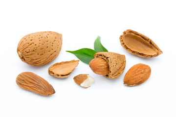 Almonds with leaves isolated on white background