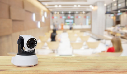 Security camera on Wood table. IP Camera.