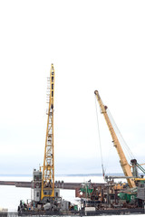 Cheboksary, Russia - April 2, 2016: floating crane in the river port in winter