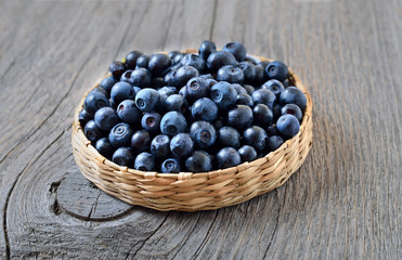 Fresh ripe blueberries on wooden table, close up