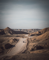 Car in Iraqi desert at summer