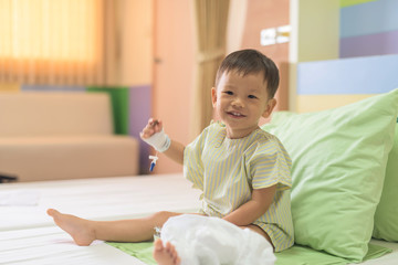 Fototapeta premium Asian boy on hospital bed