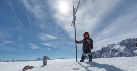 Fotobehang Cute little skier and alpine panorama. © rades