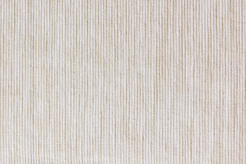 The beige texture cloth. The ribbed canvas. The background.