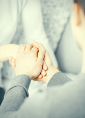 Man and woman holding hands closeup