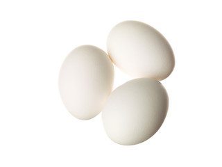 three eggs displayed on white.