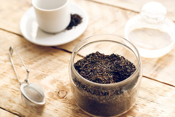 Tea set on the wooden table at sunny morning