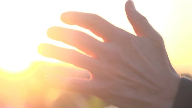 Sun through the fingers