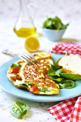 Omelet with tomatoes and spinach.