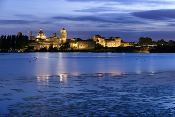 Mantua night skyline on river with moon
