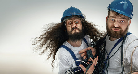 Portrait of two silly engineers - obrazy, fototapety, plakaty