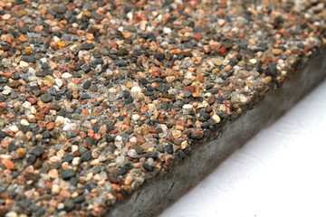 Stone surface with marble chips. View off the edges of the slab.