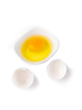 broken egg shell with yolk in bowl