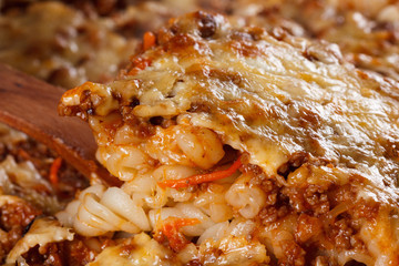 Homemade pasta with meat, cheese and tomato