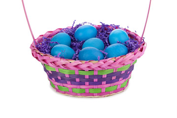 blue easter eggs in basket.