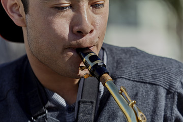 Young Man playing a Saxophone