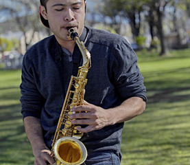 Young Man playing a Saxophone