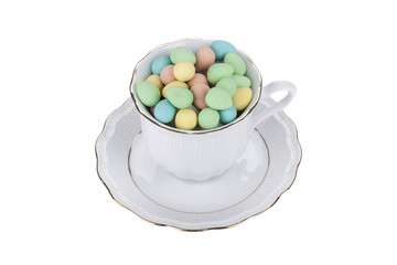 painted small eggs in a cup