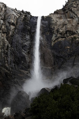 Fototapeta na wymiar Waterfall Down Rock Cliff Yosemite Park California