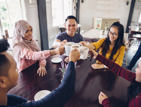 Happy Diverse Friends Cheering With Coffee