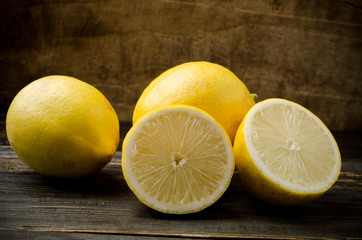 Fototapeta na wymiar Fresh lemon on wooden background