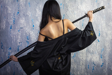 beautiful Asian girl in kimono with a katana © edinorog12