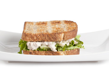 toasted egg salad sandwich in plate