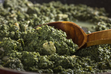 Stewed nettles with cream sauce and garlic
