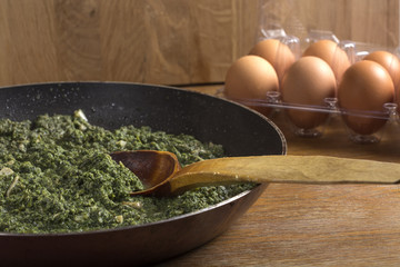 Stewed nettles with cream sauce and garlic