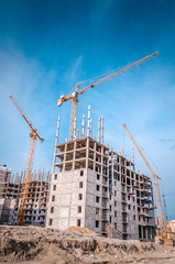 Construction site with cranes and buildings